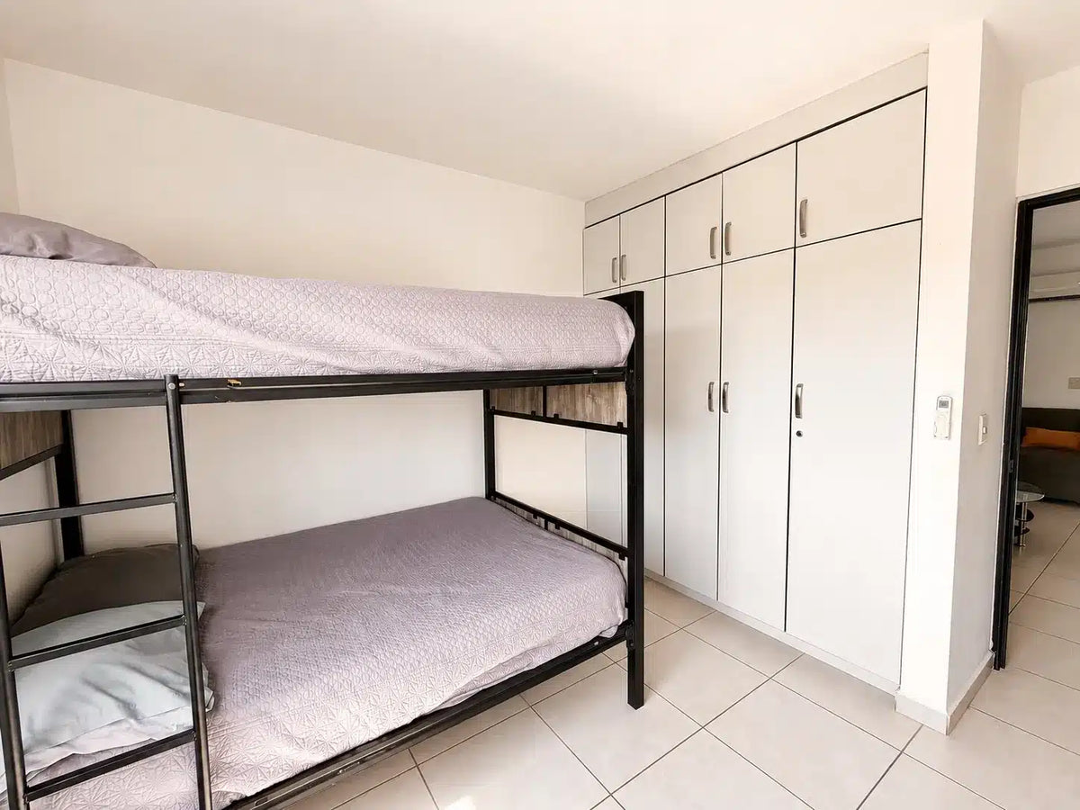 Recámara con litera doble y closets, Alejandría Residencial