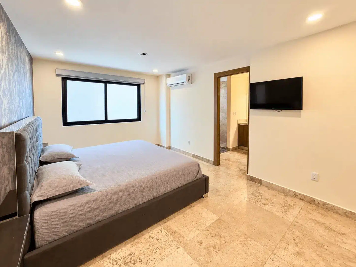 Recámara con dos camas y aire acondicionado, departamento en Torre Central 102